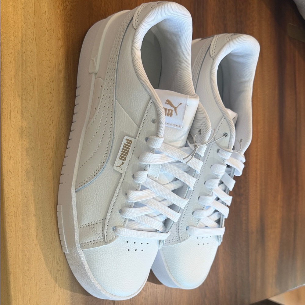 Puma Women’s White Sneakers with Gold Logo
